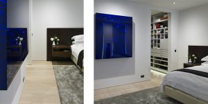 This image shows the master bedroom and artwork in the art-filled minimalist apartment in Chelsea.