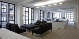 This image shows the open plan offices and break out area of the luxury fashion offices in London.