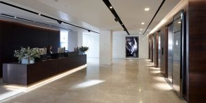 This image shows the reception desk of the luxury fashion offices in London.