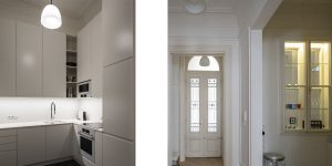 This image shows the kitchen and the detail of the glass cabinet in the historic renovated Budapest apartment, Hungary