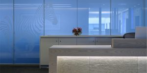 This image shows the reception desk of the asset management firm in London.
