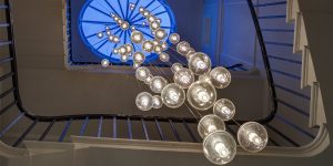 This image shows the Bocci chandelier in the stairwell in this renovated historic townhouse in London.