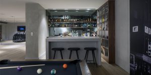 This image shows the games room and bar of this renovated, listed villa in St John's Wood, London.
