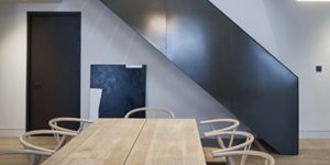 This image is of the metal bronze staircase to the upper levels, as seen from the Dining Room of one of the three luxury duplex apartments in Central London.