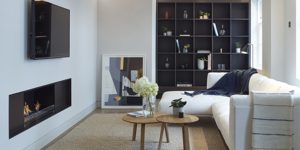 This image shows the Living Room nook with fireplace and shelving of one of the three luxury duplex apartments in Central London.