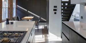 This image shows the kitchen and dining area of one of the three luxury duplex apartments in Central London.