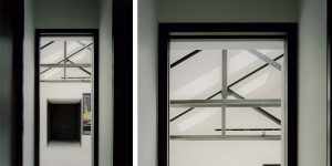This image shows the view from the bedroom corridor to the living room and entrance to the loft apartment.
