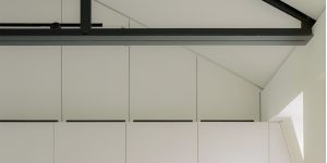 This image shows the wardrobe joinery in the Master Bedroom with the air conditioning diffusers hidden above the wardrobes in the loft apartment.